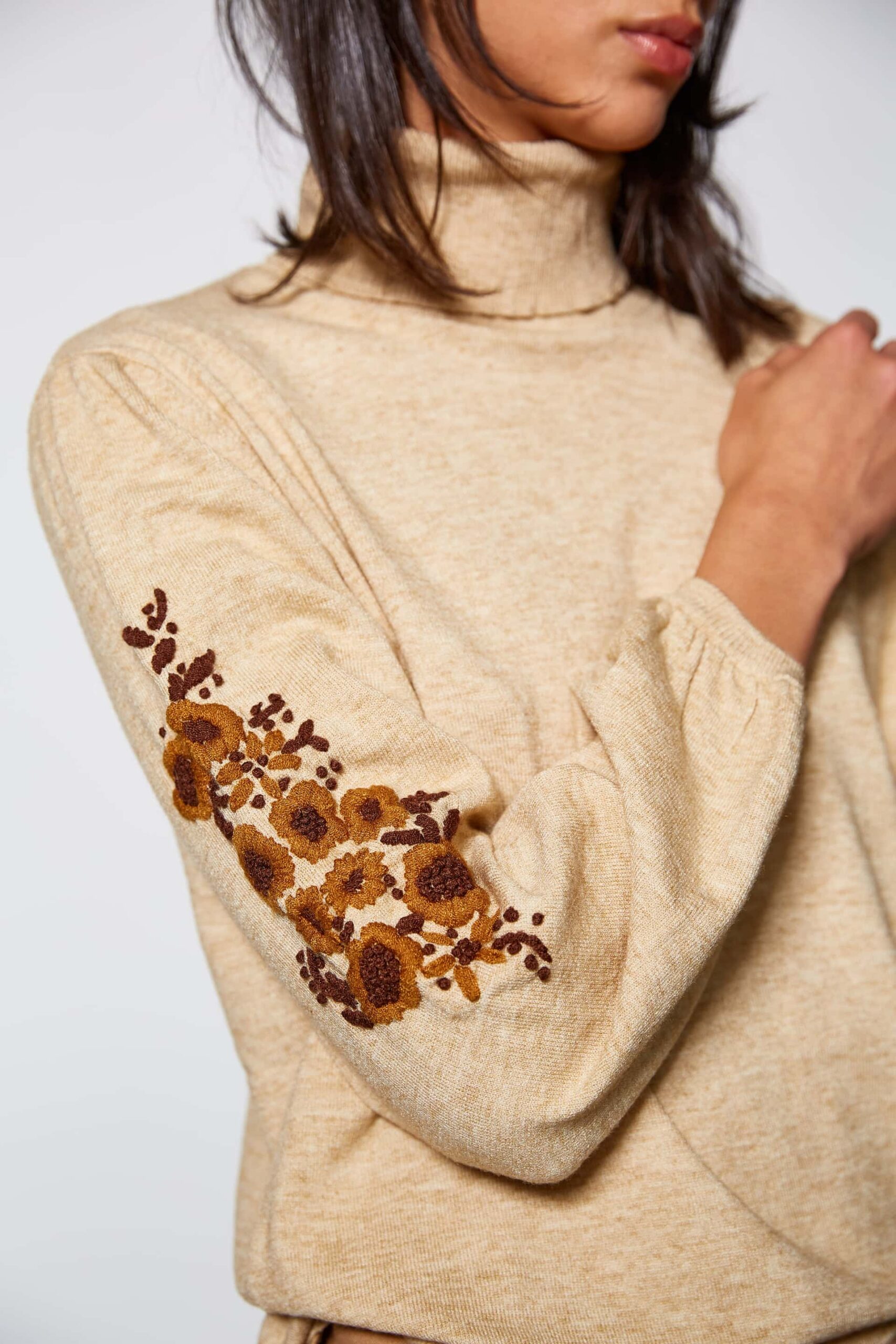 Sweater with floral detail on sleeves